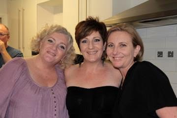 Anne in 2012 with two friends at a kitchen gathering